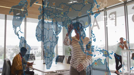 animation of world map against african american woman wearing vr headset at office