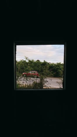 window view to trees and road