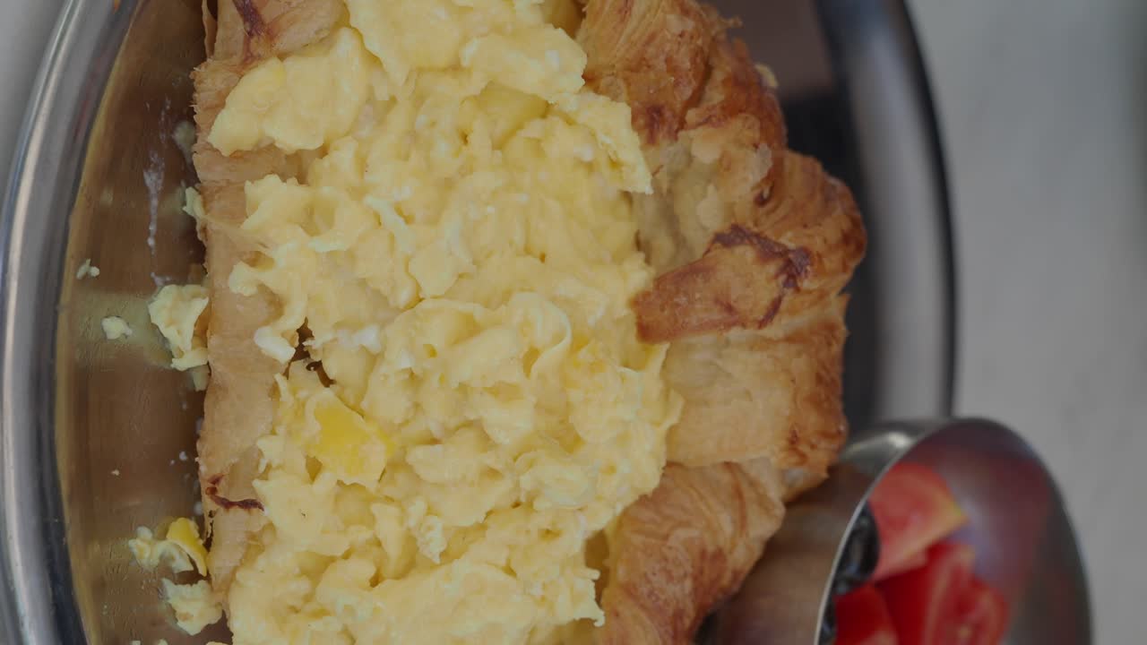Croissant with Scrambled Eggs and Salad
