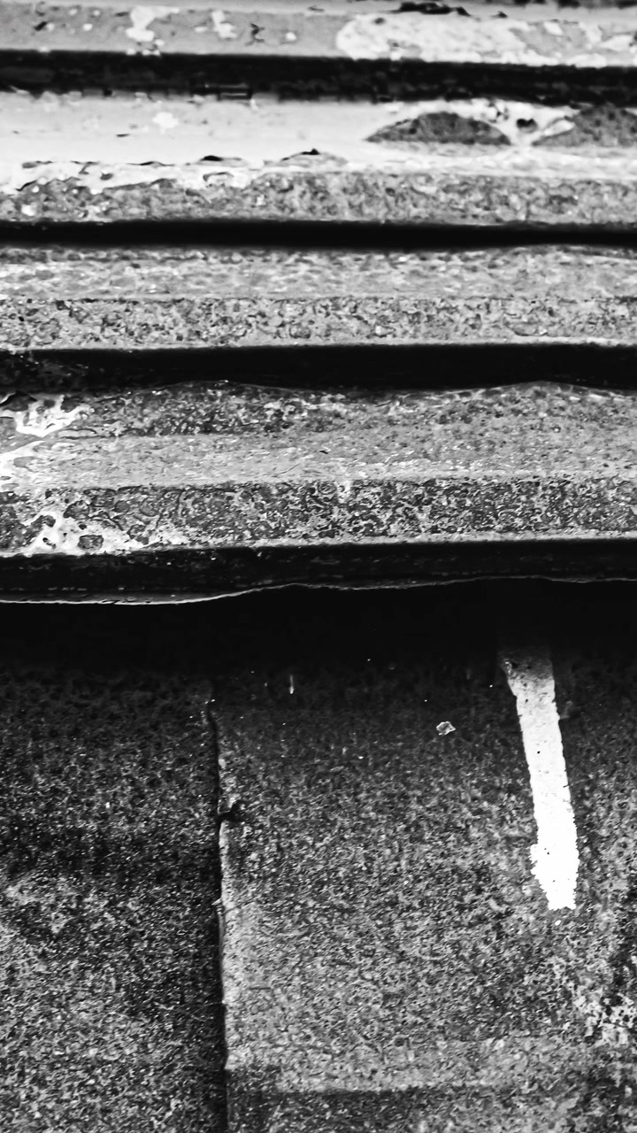 Abstract metal texture with white paint drips