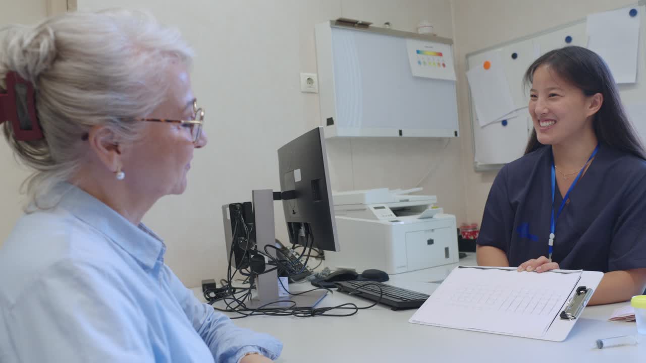 Doctor consulting with elderly patient