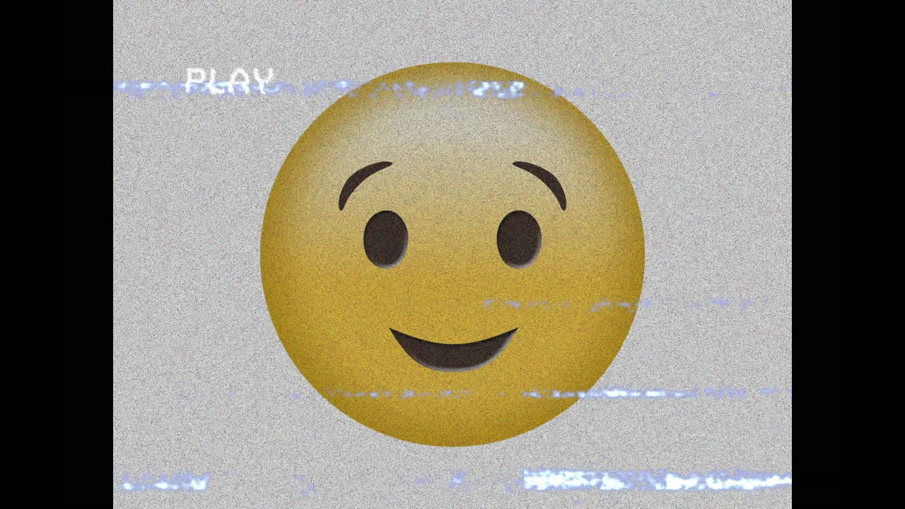 Digital animation of vhs glitch effect against winking face emoji on grey background