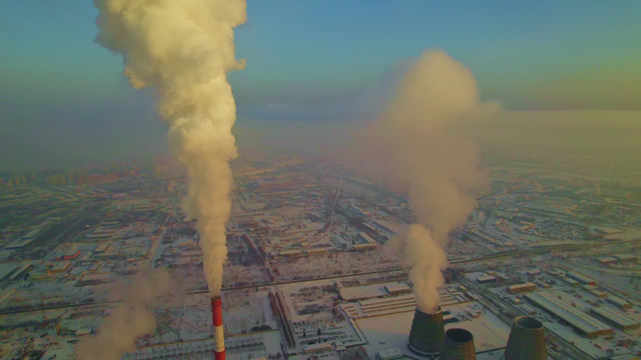 Power Plant in Winter Cityscape with Smoke Emissions