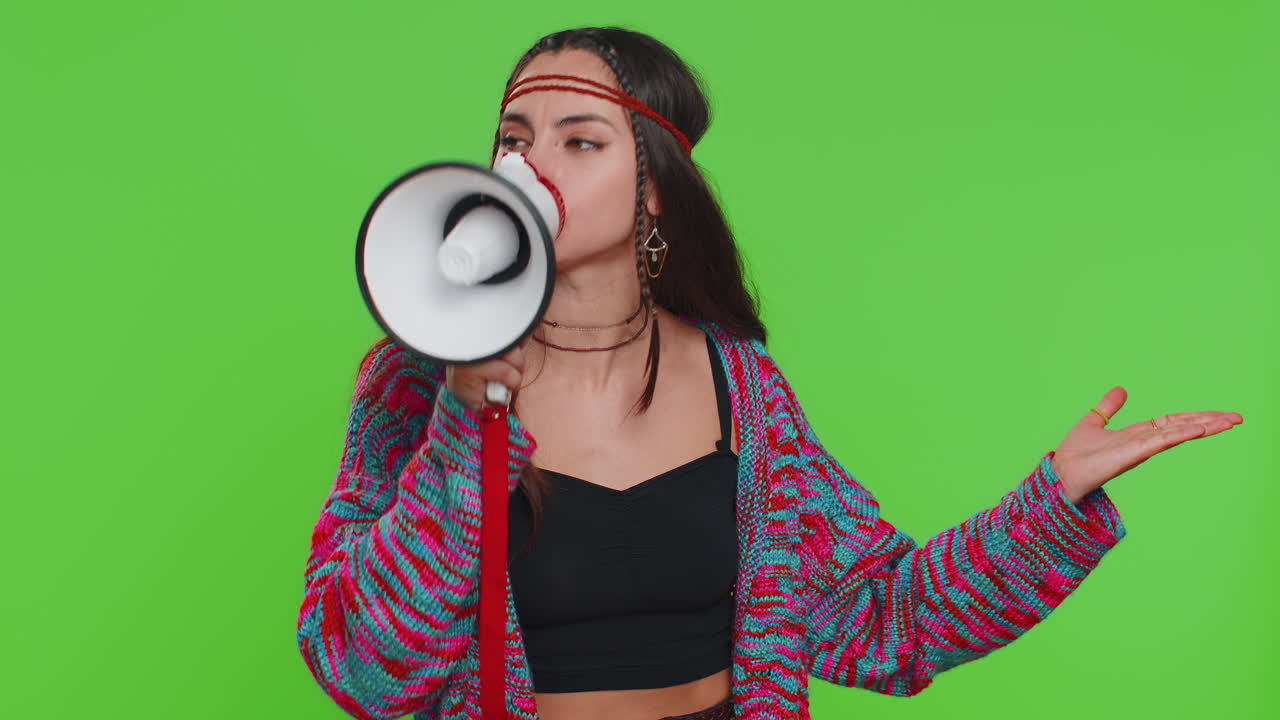 Woman talking with megaphone proclaiming news loudly announcing advertisement pointing empty place
