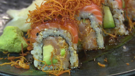 close-up of a salmon avocado sushi roll