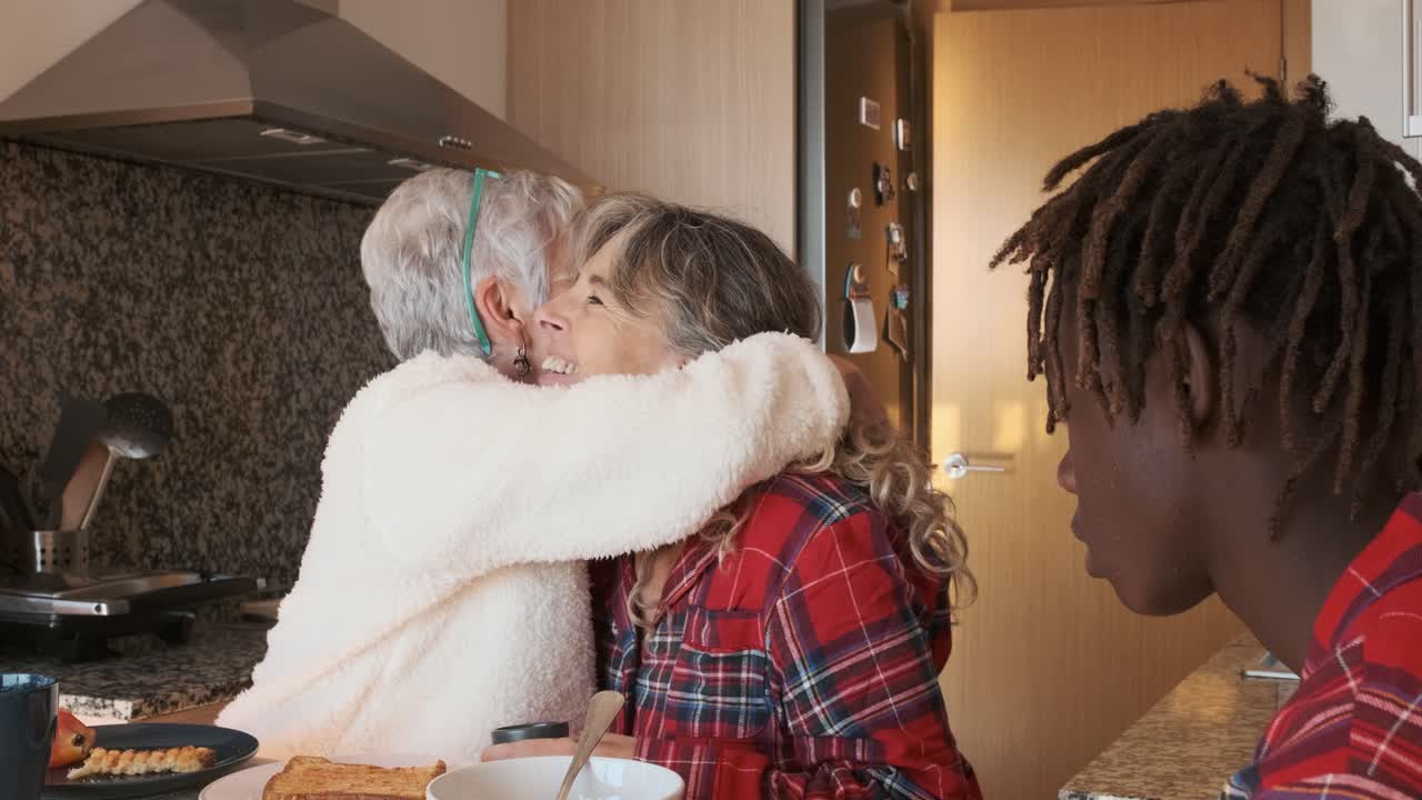 Friends and Family Laughing Together at Breakfast