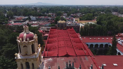 drone reveals the coyoacan zone as it passes over church