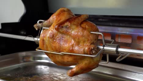 rotisserie chicken is grilled with a rear burner