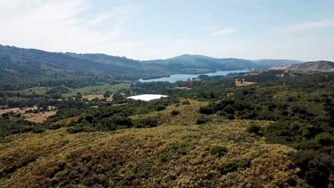 Mountains-and-Lake-at-Crystal-Spring-Reservoir-aerial-drone-time-lapse-move-forward