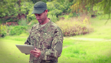 happy soldier using tablet computer