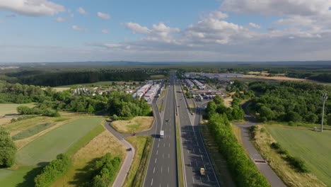 aerial view of a highway rest area with numerous trucks