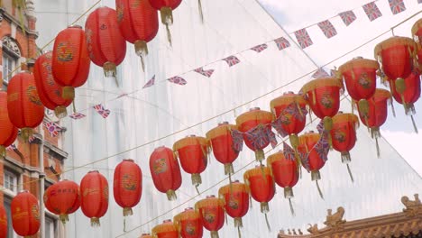 chinese lanterns hanging above a street in chinatown, london