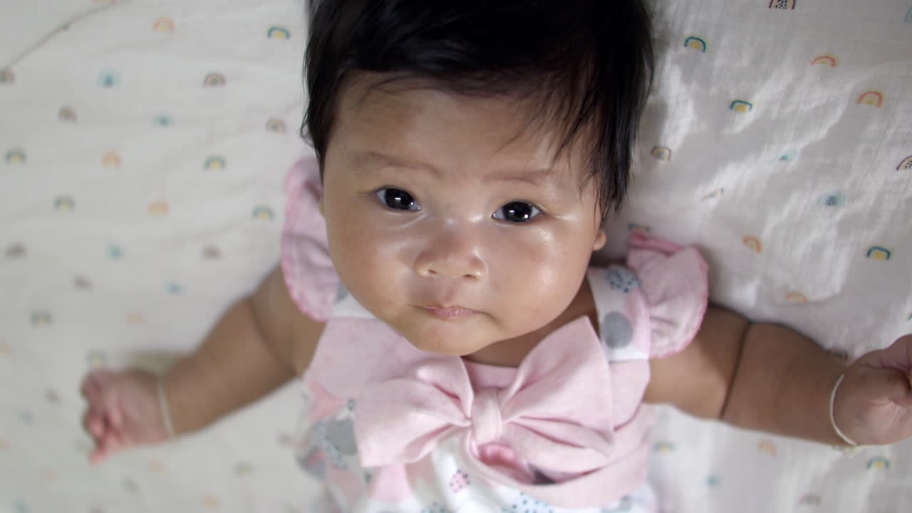Adorable Baby Girl Lying on Her Back