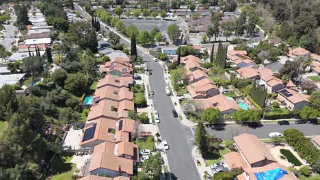 aerial flyover of homes in the granada hills neighborhood of los angeles, california.