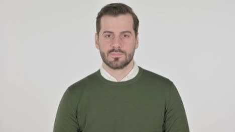 hombre poniendo el dedo en los labios, silencio, pantalla blanca