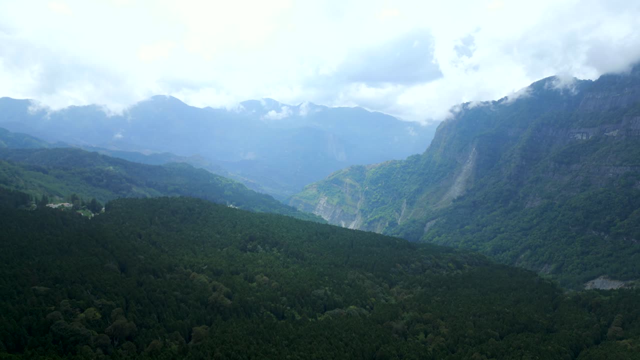 Scenic aerial shot of Alishan National Forest in Taiwan, featuring lush mountains