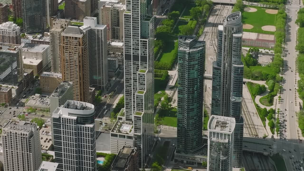 View of Chicago skyline with buildings and green spaces from above