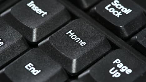 man pressing hitting the home shortcut key on a desktop pc computer keyboard, button macro, detail, extreme closeup. main home directory, work from home, e-learning at home simple abstract concept