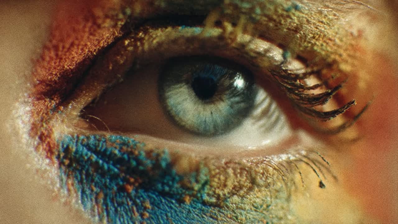 A striking close-up of an eye adorned with vibrant, artistic face paint showcasing a mesmerizing blend of colors that captivates viewers and highlights creativity