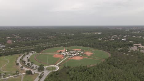 Aerial-flight-to-modern-sport-complex-with-four-baseball-diamonds