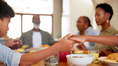 black family, praying and food in home