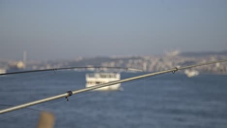 Fishermen-fishing-on-the-Bosphorus,-Galata-Bridge,-with-a-sea-view