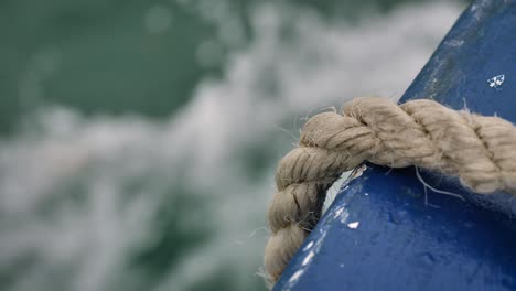 Close-view-of-old-rope-on-boat-moving-along-the-Tweed-River,-Northern-New-South-Wales,-Australia