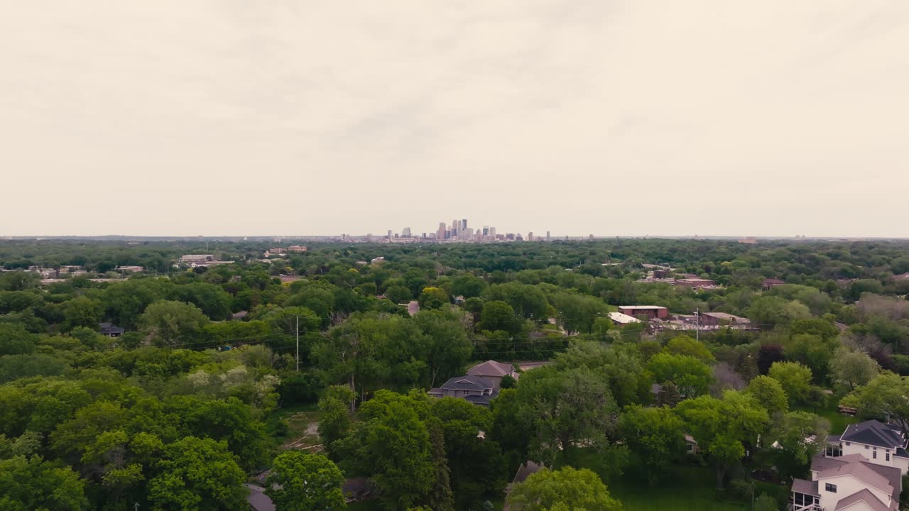 distant aerial drone shot of the city of Minneapolis skyline in Minnesota