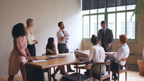 Middle-aged-black-businessman-leading-team-meeting