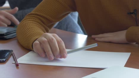 student taking notes in class