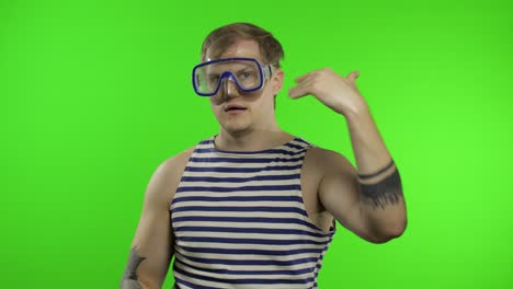 emotional man tourist in underwater mask, striped sailor shirt on chroma key