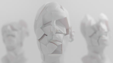 three crushed android heads on spikes in white space