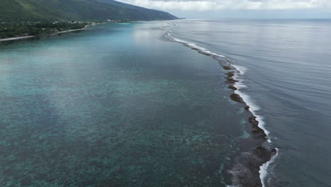lagoon and coral reefs of plage vaiava in puna'auia, french polynesia. aerial drone shot