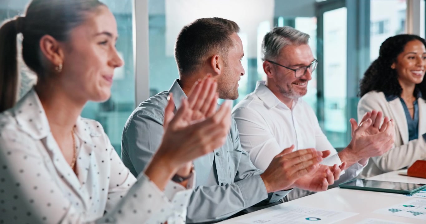 Diverse Business Team Applauding During a Corporate Meeting