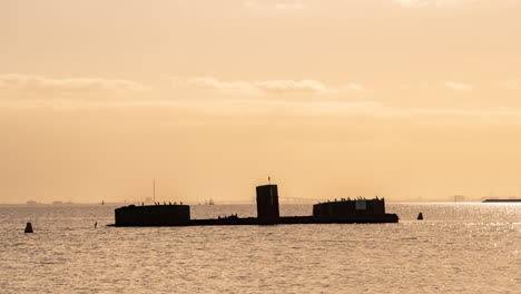 Timelapse-day-to-sunset-of-Shipwreck-in-Black-Rock-Melbourne-Victoria-Australia-HMVS-Cerberus-colonial-warship-Naval-Forces-Royal-Australian-Navy-situated-south-of-Melbourne-in-Port-Phillip-Bay