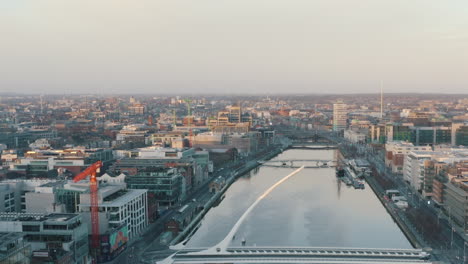 aerial reveal, dublin city at sunrise, the streets are nearly empty as this footage was taking on christmas morning.