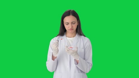 Confused-Indian-female-scientist-doing-experiments-Green-screen