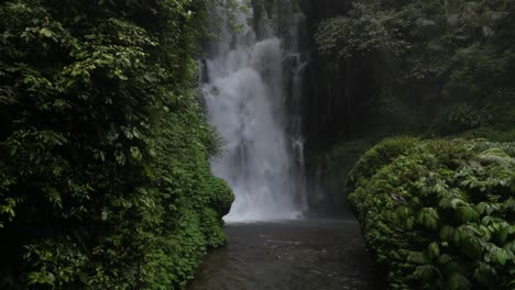powerful gusts of wind from a waterfall in the depths of jungle in bali, indonesia