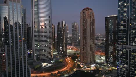 4k:skyscrapers of dubai marina district with modern buildings and city traffic