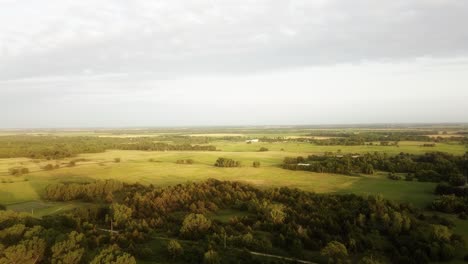 aerial rising over kansas farmland in the summertime