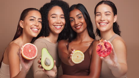 diverse group of women promoting healthy skincare with fruit