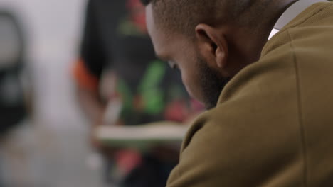 successful black business people using laptop sharing ideas team leader businessman collaborating with colleagues pointing at screen in office close up