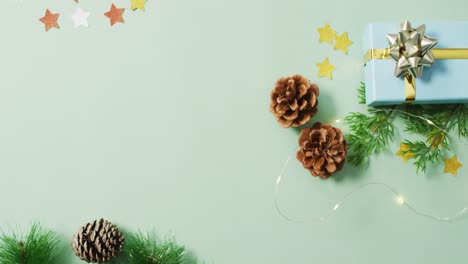 Video-of-christmas-decorations-with-pine-cones-on-white-background