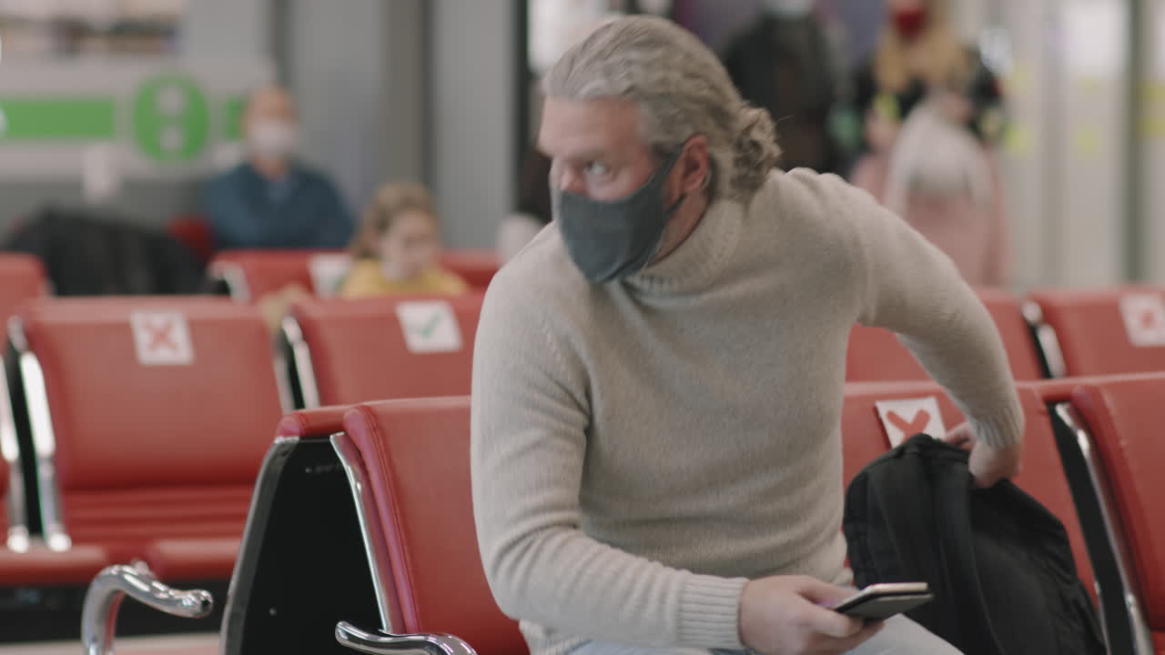 Man At Departure Lounge Before Boarding