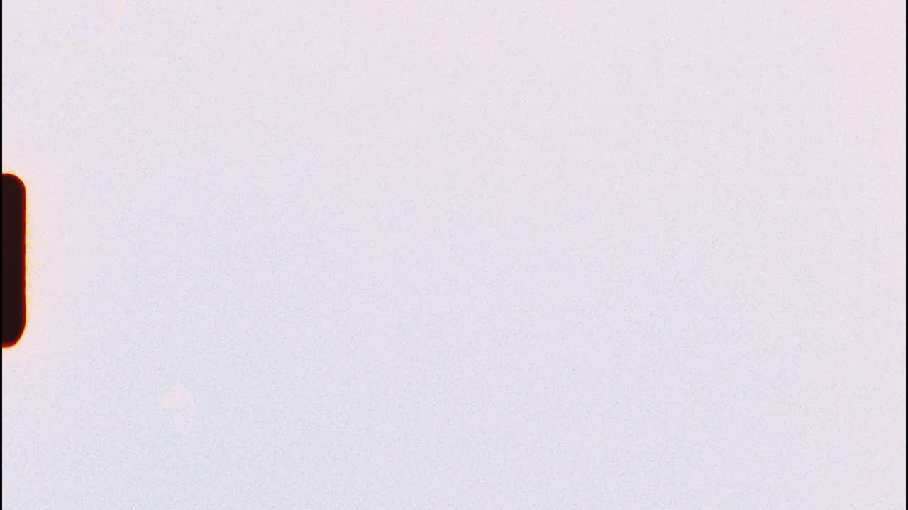 Filmed on super 8 film - retro style 8mm film leader background with visible damage, scratches and light leaks