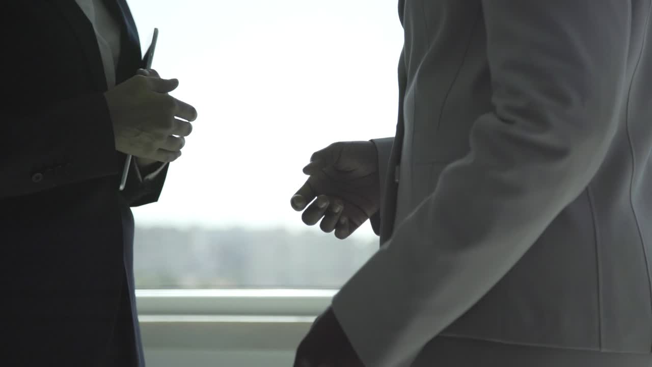 Cropped shot of businesswomen shaking hands