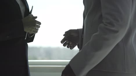 cropped shot of businesswomen shaking hands