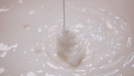 milk pouring into a bowl