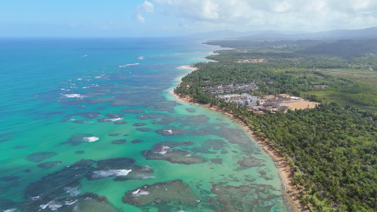 Caribbean coastline, Playa El Portillo, Las Terrenas in Dominican Republic. Aerial forward