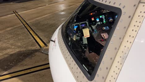 external view of a modern medium size jet cockpit powered, night light